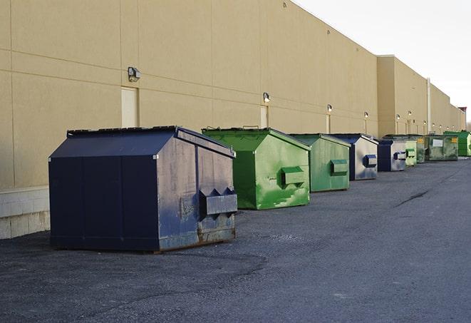 several large trash cans setup for proper construction site cleanup in Alpine